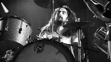 Ozzy Osbourne sets Bill Ward beard on fire.