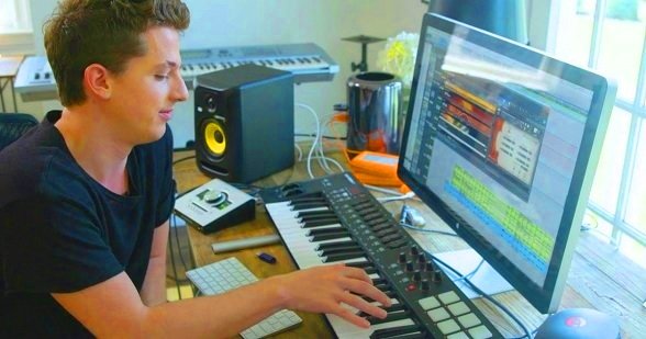 Charlie Puth making music on his computer