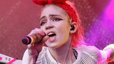 Grimes screamed in pain when her live ear piece electrocuted her during a live performance.