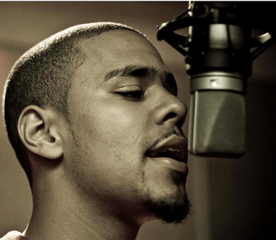 J Cole recording a song