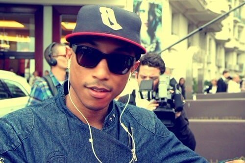 Pharrell Williams wearing hat and shades