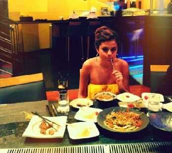 Selena Gomez has a weakness for burgers and coke